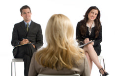 This image shows a woman being interviewed by 2 people. An interview can be daunting but by following this advice you too can be successful.